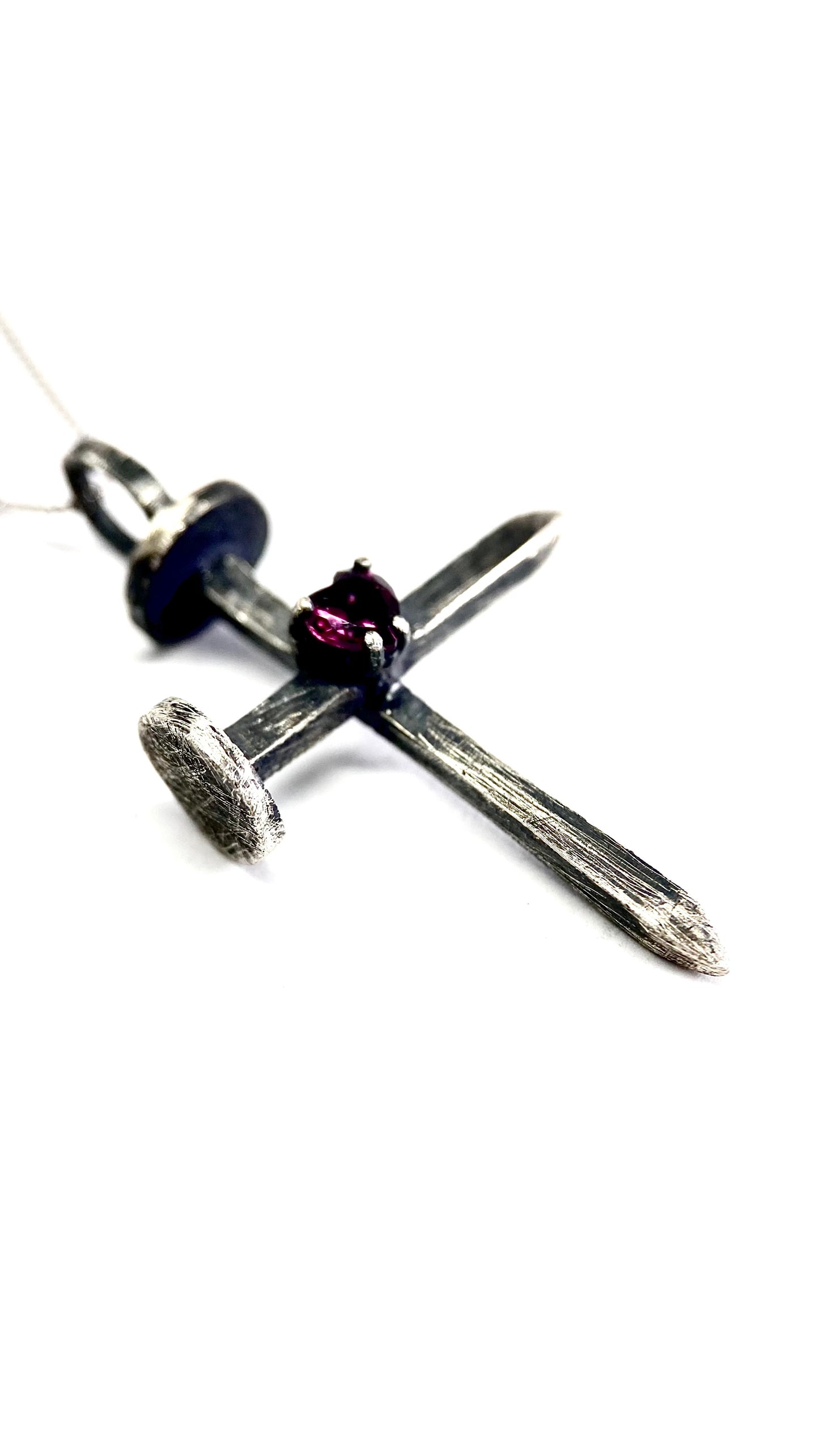 Nail with a rodolite