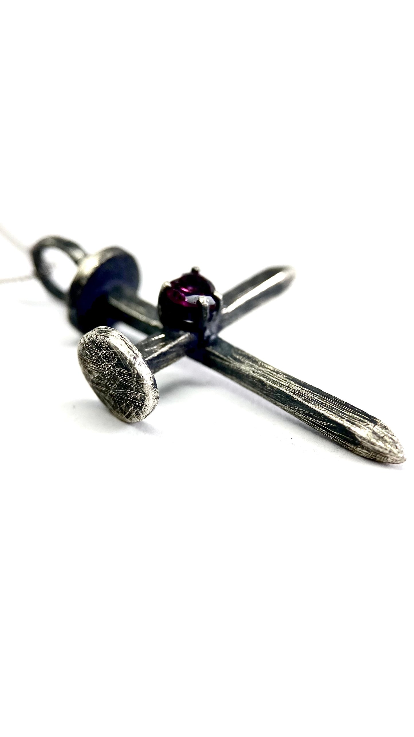 Nail with a rodolite
