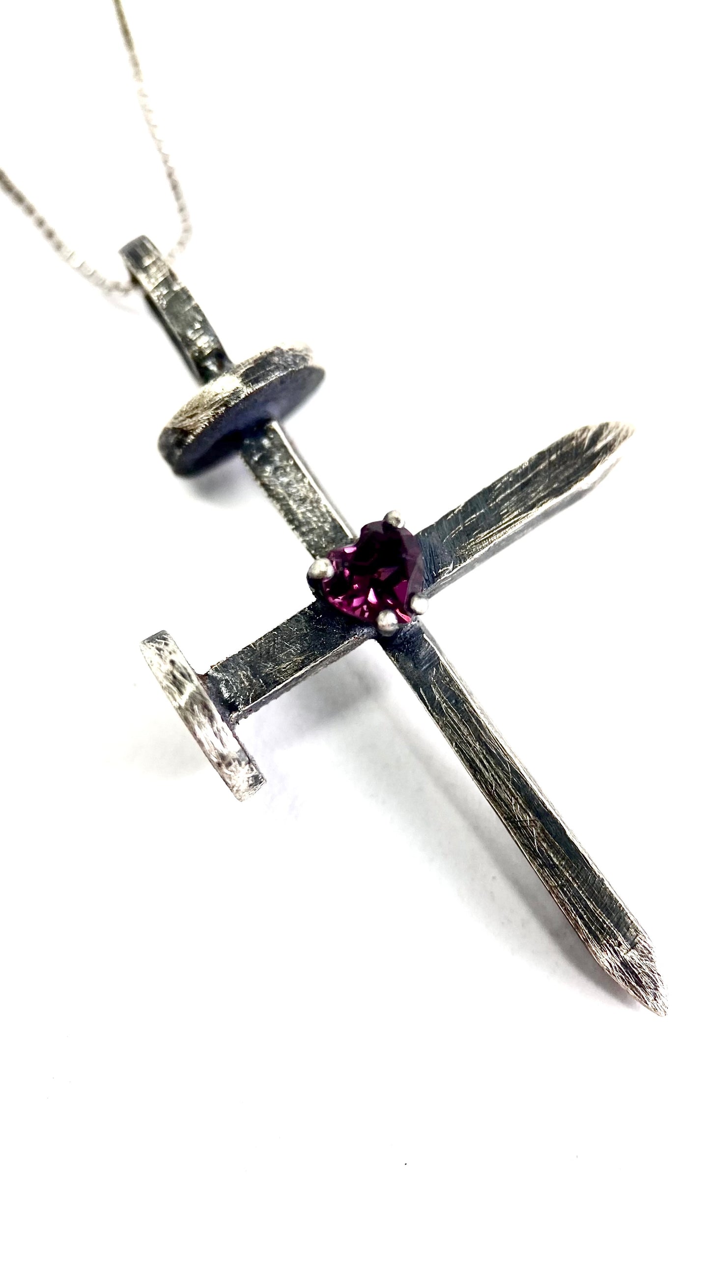 Nail with a rodolite